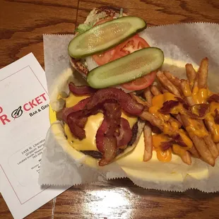 All American Burger-  8oz steak burger topped with bacon, lettuce, tomato and onion.  Served with Fries