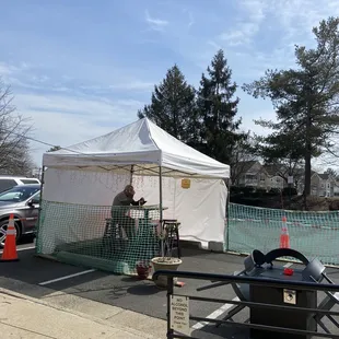 a tent set up in a parking lot