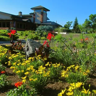 Red Rocks Country Club flower garden and clubhouse