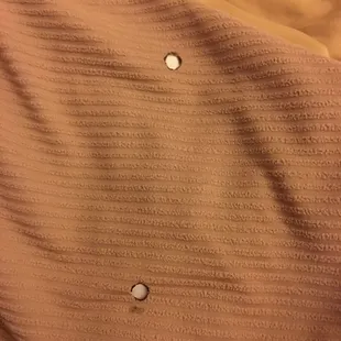 Cigarette burns in the blanket of our "100% Smoke Free" room in the "100% Smoke Free" hotel.