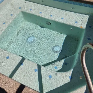 Hot tub with debris.