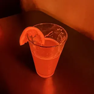 a drink with a slice of lemon