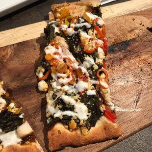 Jerk chicken flatbread.. perfect amount of spice. Delish!