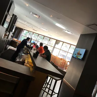 people sitting at a bar