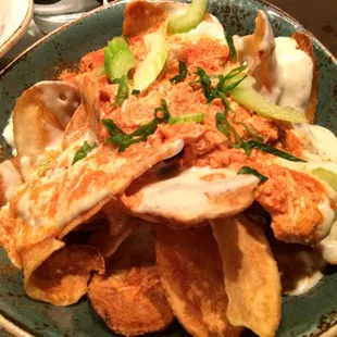Buffalo Chicken Chips. Kettle fried potatoes with spicy shredded chicken.