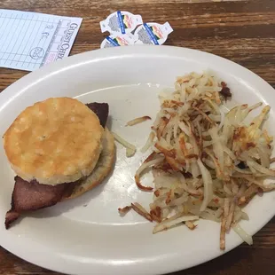 Country ham and a very fresh biscuit with a side of hash Hashbrowns