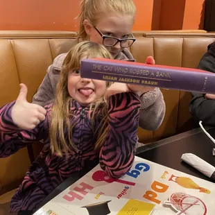 Fun books for the kids to read to stay occupied at the table.