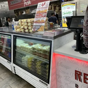 a counter with a variety of pastries