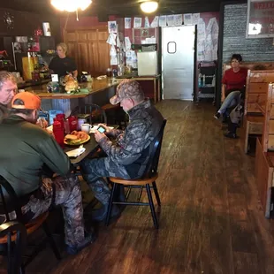 a group of people sitting at a table