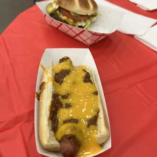 a hot dog with cheese and mustard