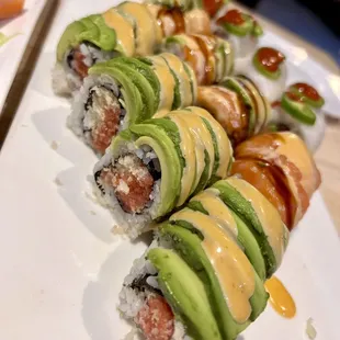 sushi rolls with avocado and sauce