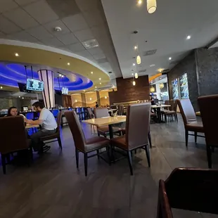 a man sitting at a table in a restaurant