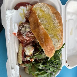 a sandwich in a styrofoam container