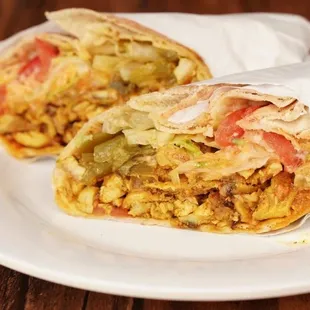 two burritos on a white plate