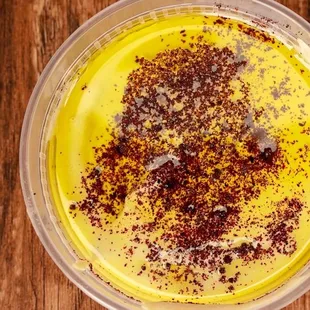 a bowl of food on a wooden table