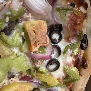 Rotten tomato on veggie pizza