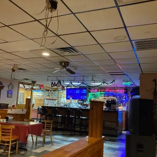 Bar, music stage and some dining tables.