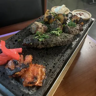 a grill with meat and vegetables