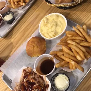 Plate with pulled chicken and two sides.