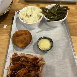 Pulled chicken, Green Beans   Bacon - Small, Potato Salad - Small &amp; cornbread muffin.
