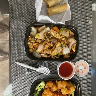 two trays of food on a table