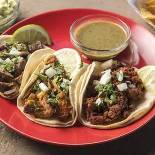 a plate of tacos and chips