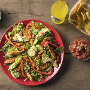 a plate of salad and chips