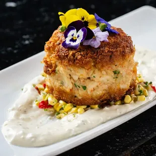 Our Alaskan King Crab Cake is served with Sweet Corn Salsa &amp; Classic Remoulade