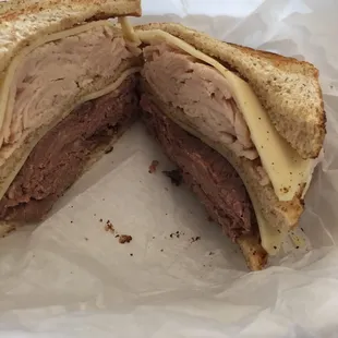 a sandwich and chips in a basket