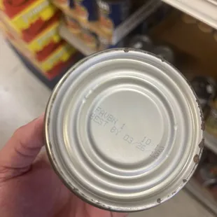 Old rusty can of expired food.