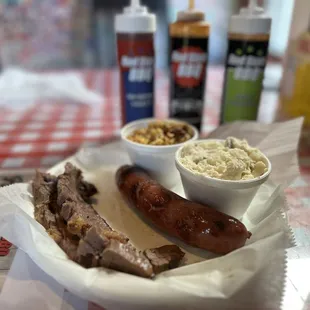 2 meat plate (brisket and jalapeño cheddar sausage w corn pudding and potato salad.