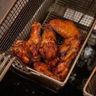 a basket full of chicken wings