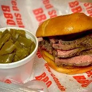 a beef sandwich with pickles