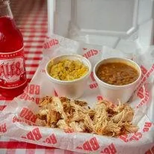 a tray of food and a bottle of bbq