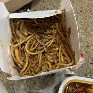 a box of noodles and a bowl of soup