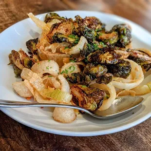 a plate of food on a wooden table