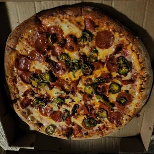 Pepperoni, jalapeño, and bacon bits on regular crust.