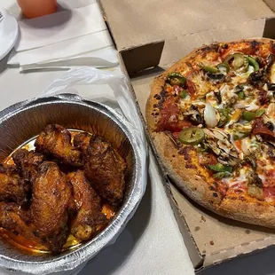 Spicy wings and supreme small pizza.