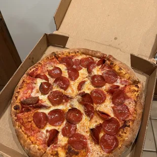 a pepperoni pizza in a box