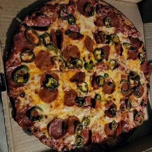 Pepperoni, jalapeño, and extra sauce on thin crust.