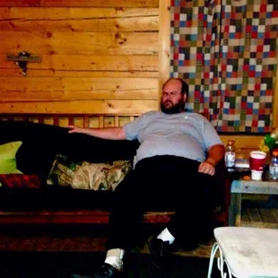 This is one of the medium-size cabins and this is the living room area with our dog in my husband