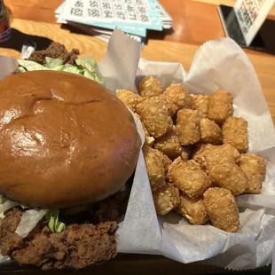 Chicken sandwich and tater tots.