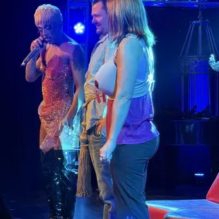 The audience members--no relation--with their clothing additions--her bra, his tassel.