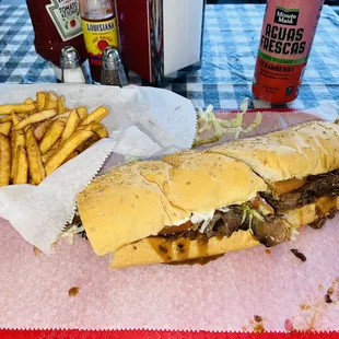 a sandwich and french fries on a table