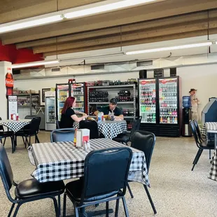 a restaurant with black and white checkered tables and chairs
