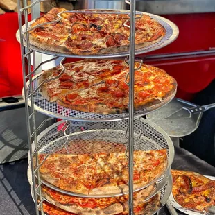 a display of pizzas