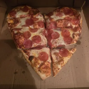 Heart-shaped pizza day after v-day.. genius.