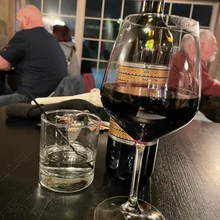 Our drinks. A red blend and a double of vodka.