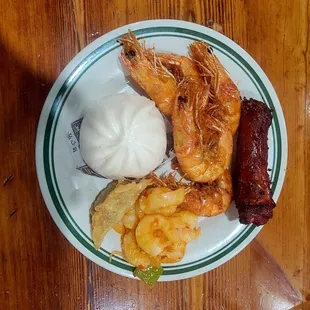 Cha siu bau, deep fried head on shrimp, char siu pork ribs mayonnaise shrimp and a pot sticker