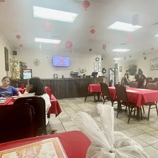 people sitting at tables in a restaurant